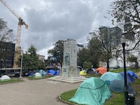 A tent encampment on the Grand Parade in Halifax is shown on Oct.16, 2023. The civil servant overseeing delivery of 200 insulated shelters for the homeless in Nova Scotia is pointing to the need for community "buy in" and proper access to services like washrooms before they are installed. THE CANADIAN PRESS/Lyndsay Armstrong