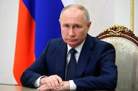 Russian President Vladimir Putin makes a video address to participants of the 2nd National Healthcare Congress at the Kremlin in Moscow, Russia, Friday, Dec. 1, 2023. Putin on Friday ordered the country's military to increase the number of troops by nearly 170,000 to a total of 1.32 million, as Moscow’s military action in Ukraine continues into its 22nd month. (Mikhail Klimentyev, Sputnik, Kremlin Pool Photo via AP)