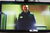 Russian opposition leader Alexei Navalny is seen on a TV screen, as he appears in a video link provided by the Russian Federal Penitentiary Service in a courtroom of the Basmanny Court in Moscow, Russia, on Wednesday, April 26, 2023. Canada is again joining the U.S. and Britain in sanctioning officials accused of corruption, this time involving Russia’s justice system. THE CANADIAN PRESS/AP-Alexander Zemlianichenko
