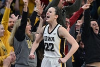 Feb 15, 2024; Iowa City, Iowa, USA; Iowa Hawkeyes guard Caitlin Clark (22) reacts with fans after breaking the NCAA women's all-time scoring record during the first quarter against the Michigan Wolverines at Carver-Hawkeye Arena. Mandatory Credit: Jeffrey Becker-USA TODAY Sports