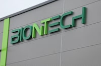 FILE PHOTO: The logo of BioNTech is pictured at Biontech's research laboratory for individualised vaccines against cancer in Mainz, Germany, July 27, 2023. REUTERS/Wolfgang Rattay/File Photo