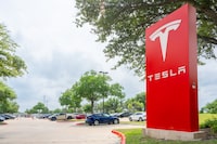 The Tesla logo is displayed at a Tesla dealership on April 15, 2024 in Austin, Texas.