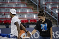 Bianca Andreescu and her hitting partner, J.T. Nishimura, practice doubles with their coaches ahead of the start of the WTA tournament at the IGA Stadium in Montreal on Aug. 04, 2023. As Andreescu's hitting partner, Nishimura helps her practice for her upcoming opponents. The coaches were supervised by their respective coaches, who stood by and guided the practice matches.  
(04/08/2023)
(Andrej Ivanov/The Globe and Mail)