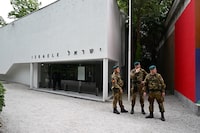 Italian soldiers stand guard in front of the Israel's pavilion during the pre-opening of the Venice Biennale art show, on April 16, 2024 in Venice. The artist representing Israel at the Venice Biennale called  for a ceasefire in the war with Hamas and said her exhibit would remain closed until the hostages were released. Ruth Patir's video installation "(M)otherland" was due to open on April 20 at Israel's national pavilion at the international art show, but the day before a media preview, she said it would remain closed for now. (Photo by GABRIEL BOUYS / AFP) (Photo by GABRIEL BOUYS/AFP via Getty Images)