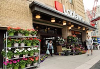Loblaw Cos. Ltd. reported its fourth-quarter profit and sales rose compared with year ago. A man leaves a Loblaws store in Toronto on Thursday, May 3, 2018.  THE CANADIAN PRESS/Nathan Denette