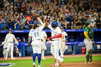 Toronto Blue Jays' Vladimir Guerrero Jr. (right) celebrates with Bo Bichette (11) after hitting a three-run home run during third inning MLB baseball action against the Oakland Athletics, in Toronto on Friday, June 23, 2023. THE CANADIAN PRESS/Christopher Katsarov
