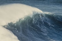 Celebrity surf champian and big wave rider João Macedo on a big wave, Nazaré, Portugal. Original photo by Ricardo Bravo