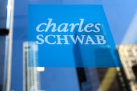 FILE PHOTO: The company logo for Financial broker Charles Schwab is displayed at a location in the financial district in New York, U.S., March 20, 2023.  REUTERS/Brendan McDermid/File Photo