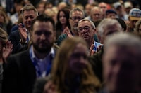 Party members applaud Alberta Premier Danielle Smith at the United Conservative Party AGM in Edmonton, on Saturday, October 22, 2022. THE CANADIAN PRESS/Amber Bracken