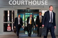 Fox News attorneys exit the Leonard L. Williams Justice Center as jury selection commences for a trial to decide whether Fox News should pay Dominion Voting Systems $1.6 billion for spreading election-rigging falsehoods, in Wilmington, Delaware, U.S. April 13, 2023. REUTERS/Eduardo Munoz