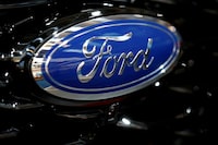 FILE PHOTO: The Ford logo is pictured at the 2019 Frankfurt Motor Show (IAA) in Frankfurt, Germany. REUTERS/Wolfgang Rattay