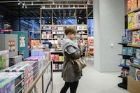 People are seen touring a new location of Indigo Books and Music, in the Well, downtown Toronto, on Thursday Oct. 26, 2023. (Christopher Katsarov/The Globe and Mail)