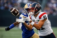 Montreal Alouettes' Austin Mack (81) catches the pass against the Winnipeg Blue Bombers during first half CFL action in Winnipeg Thursday, August 24, 2023.    THE CANADIAN PRESS/John Woods