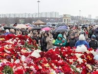 People lay flowers at a makeshift memorial near the Crocus City Hall, a popular concert venue where at least 115 people were killed and more than 140 injured Friday night in an attack outside Moscow, on Sunday, March 24, 2024. American officials attribute Friday’s attack in a Moscow suburb, which killed at least 137 people, to a branch of the Islamic State active in Iran and Afghanistan. (Nanna Heitmann/The New York Times)