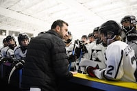 Head coach Mike Simeoni speaks to players of the Under 16 Thunder Bay Kings before playing the Toronto Jr. Canadiens, during a Greater Toronto Hockey League game, in Toronto, Saturday Nov. 11, 2023. (Christopher Katsarov/The Globe and Mail)
