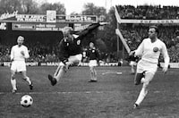 FILE - England's Bobby Charlton, plays for the Rest of Europe against Scandinavia, in a show soccer match to celebrate the 75th anniversary of the Danish Football Association, in Copenhagen, Denmark. Bobby Charlton, an English soccer icon who survived a plane crash that decimated a Manchester United team destined for greatness to become the heartbeat of his country's 1966 World Cup-winning team, has died. He was 86. A statement from Charlton's family, released by United, said he died Saturday Oct. 21, 2023 surrounded by his family. (AP Photo/File)