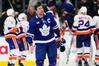 Toronto Maple Leafs' John Tavares (91) skates off the ice as the New York Islanders celebrate their win in NHL hockey action in Toronto on Monday, February 5, 2024.&nbsp;Tavares is taking the Canadian Revenue Agency to court in a tax dispute of over $8 million. THE CANADIAN PRESS/Frank Gunn