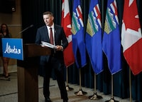Alberta Finance Minister Nate Horner arrives to speak to the media at a news conference in Calgary, Thursday, June 29, 2023. Albertans will have to wait until the fall before they learn what the federal government thinks they should get if the province quits the Canada Pension Plan. THE CANADIAN PRESS/Jeff McIntosh