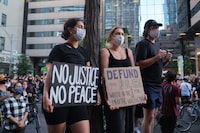 TORONTO, ONT (08/29/20) — Demonstrators calling for the defunding of police marched down Bloor St. From Christie Pits to police head quarters on Saturday afternoon. The march was the second such rally in Toronto on Saturday, the first taking place at Downsview Park in North York. Rallies were held in cities across Canada Saturday, including London, Fredricton, Moncton, Halifax and Montreal, where protestors toppled a statue of John A. Macdonald. Yader Guzman/The Globe and Mail
