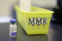 A measles, mumps and rubella vaccine is shown on a countertop at a pediatric clinic in Greenbrae, Calif. on Feb. 6, 2015. York Region's medical officer of health says a man who got measles had "close contacts" among students and teachers at a high school in the region. THE CANADIAN PRESS/AP, Eric Risberg