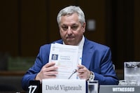David Vigneault, Director of the Canadian Security Intelligence Service (CSIS), organizes his notes as he prepares to appear before the Standing Committee on Procedure and House Affairs (PROC), studying the intimidation campaign against Members of Parliament, on Parliament Hill in Ottawa, on Tuesday, June 13, 2023. THE CANADIAN PRESS/Justin Tang