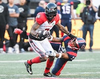 Montreal Alouettes' Najee Murray, right, tackles Ottawa Redblacks' Quan Bray during first half CFL football action in Montreal, Saturday, June 10, 2023. It cost him a chance to play in the Grey Cup but Murray is thankful his season-ending pectoral injury happened when it did.THE CANADIAN PRESS/Graham Hughes