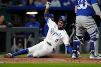 KANSAS CITY, MISSOURI - APRIL 23:  Maikel Garcia #11 of the Kansas City Royals scores on a Bobby Witt Jr. double in the fifth inning against the Toronto Blue Jays at Kauffman Stadium on April 23, 2024 in Kansas City, Missouri. (Photo by Ed Zurga/Getty Images)