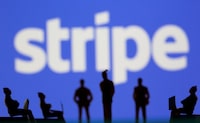 FILE PHOTO: Small toy figures are seen in front of Stripe logo in this illustration picture taken March 15, 2021. REUTERS/Dado Ruvic/Illustration/File Photo