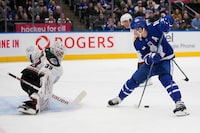 Feb 29, 2024; Toronto, Ontario, CAN; Toronto Maple Leafs forward Mitchell Marner (16) passes the puck to forward Matthew Knies (not pictured) as he closes in on Arizona Coyotes goaltender Connor Ingram (39) during the first period at Scotiabank Arena. Mandatory Credit: John E. Sokolowski-USA TODAY Sports