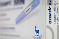 (FILES) This photograph taken on February 23, 2023, in Paris, shows the logo of Danish pharmaceutical company "Novo Nordisk" on the anti-diabetic medication "Ozempic" (semaglutide) box. The Danish laboratory Novo Nordisk, the largest European capitalization, presented sharply increasing results on November 2, 2023, driven by the success of its anti-diabetic and anti-obesity treatments, Ozempic and Wegovy. (Photo by JOEL SAGET / AFP) (Photo by JOEL SAGET/AFP via Getty Images)