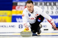 Canada's skip Brad Gushue delivers a stone against the Czech Republic at the men's Curling World Championships in Schaffhausen, Switzerland, Saturday, March 30, 2024. Gushue clinched a playoff spot with a 7-4 nine-end win over Magnus Ramsfjell of Norway at the world men's curling championship on Thursday. THE CANADIAN PRESS/AP-Michael Buholzer/Keystone via AP