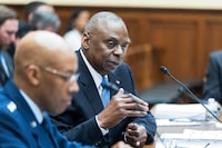 Secretary of Defense Lloyd Austin with Chairman of the Joint Chiefs, Air Force Gen. Charles Q. Brown Jr., testifies before a House Armed Services Committee hearing on the Department of Defense fiscal 2025 budget request on Capitol Hill, Tuesday, April 30, 2024, in Washington. (AP Photo/Manuel Balce Ceneta)