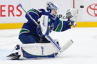 Vancouver Canucks goalie Collin Delia allows a goal to Colorado Avalanche's Samuel Girard, not seen, during the second period of an NHL hockey game in Vancouver, on Thursday, January 5, 2023. THE CANADIAN PRESS/Darryl Dyck