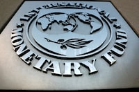 FILE PHOTO: The International Monetary Fund (IMF) logo is seen outside the headquarters building in Washington, U.S., September 4, 2018. REUTERS/Yuri Gripas/File Photo