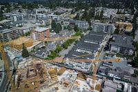 Cranes are seen above a condo development and other housing projects under construction, in Coquitlam, B.C., on Tuesday, May 16, 2023. THE CANADIAN PRESS/Darryl Dyck