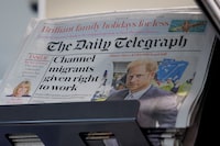 FILE PHOTO: Copies of The Daily Telegraph are displayed on a rack in a supermarket in London, Britain, January 20, 2024. REUTERS/Belinda Jiao/File Photo
