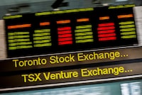 FILE PHOTO: A sign board displaying Toronto Stock Exchange (TSX) stock information is seen in Toronto June 23, 2014. REUTERS/Mark Blinch/File Photo