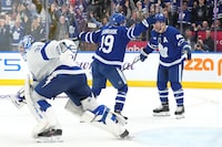 Toronto Maple Leafs centre Calle Jarnkrok (19) celebrates scoring the winning goal with defenceman Morgan Rielly (44) as Tampa Bay Lightning goaltender Jonas Johansson skates off the ice during NHL hockey in Toronto on Monday November 6, 2023.THE CANADIAN PRESS/Chris Young