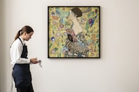 Gustav Klimt's “Dame mit Fächer” — Lady with a Fan, is shown in this hand out image released by Sotheby's. A late-life masterpiece by Austrian artist Gustav Klimt could become the most expensive painting ever sold in Europe when it is auctioned later this month. Auctioneer Sotheby’s said on Wednesday June 14, 2023, that “Dame mit Fächer” — Lady with a Fan — will go up for sale June 27 in London, with an estimated price of 65 million pounds ($80 million). (Sotheby's via AP)