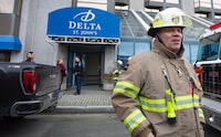 Deputy Fire Chief, Paul Chaytor briefs the media outside the Delta Hotel in St. John's on Friday, April 14, 2023. The Royal Newfoundland Constabulary says several people were taken to hospital after a suspected gas leak at the Delta Hotel in downtown St. John's. THE CANADIAN PRESS/Paul Daly
