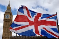 FILE PHOTO: A Union Jack flag flutters in the wind near Big Ben and Parliament in Parliament Square in London, Britain, March 29, 2024  REUTERS/Kevin Coombs/File Photo