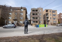 Pedestrians walk past apartment rental buildings at 2404 and 2406 Queen St. East in Toronto’s Beach neighbourhood on Mar 11, 2024. (Fred Lum/The Globe and Mail)