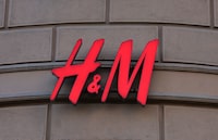 FILE PHOTO: The logo of H&M is on display outside a store on the day it closes, as the fashion retailer exits the Russian market, in Moscow, Russia November 30, 2022. REUTERS/Evgenia Novozhenina/File Photo
