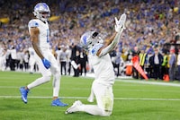 Detroit Lions running back David Montgomery (5) reacts after scoring a touchdown during the first half of a NFL football game against the Green Bay Packers Thursday, Sept. 28, 2023, in Green Bay, Wis. (AP Photo/Jeffrey Phelps)