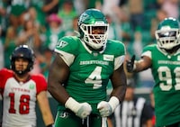 Saskatchewan Roughriders defensive lineman Micah Johnson (4) celebrates after making a tackle against Ottawa Redblacks during the second half of CFL football action in Regina on Sunday, August 6, 2023. THE CANADIAN PRESS/Heywood Yu