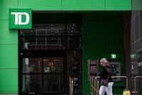 A passerby in front of TD bank on Central street S in downtown Calgary on April 26th, 2024.
(Louis Oliver/The Globe and Mail)�