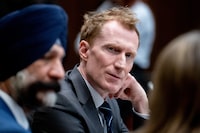 Marc Miller, Minister of Immigration, Refugees and Citizenship, waits to appear before the Standing Committee on Citizenship and Immigration related to a briefing on temporary immigration measures in response to ongoing conflicts in Sudan and Gaza in the Parliamentary Precinct in Ottawa, on Wednesday, March 20, 2024. THE CANADIAN PRESS/Spencer Colby