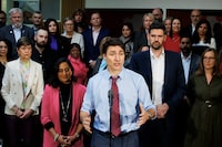 Prime Minister Justin Trudeau is flanked by Minister of Housing Sean Fraser, right, and Treasury Board President Anita Anand, left, during a press conference in Oakville, Ont., on Wednesday, April 24, 2024. Trudeau is ramping up his attacks of Conservative Leader Pierre Poilievre during a countrywide tour to promote the Liberals' federal budget.  THE CANADIAN PRESS/Cole Burston
