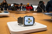 An Apple smartwatch is displayed as customers visit the Apple store in New York, U.S., December 26, 2023. REUTERS/Eduardo Munoz