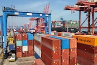Shipping containers are stacked at a port in Lianyungang, in eastern China's Jiangsu province on April 12, 2024. Chinese exports plunged more than expected in March, official figures showed on April 12, as the world's second-largest economy struggles to sustain its post-pandemic recovery. (Photo by AFP) / China OUT (Photo by STR/AFP via Getty Images)